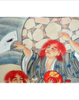 Patterned robe and fan near vintage Japanese two-panel screen with fictional characters, indoor setting.