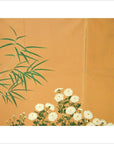 Brown wooden 2-panel screen with painted flowers, birds, and bamboo leaves, used as a floral room divider.