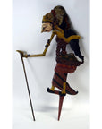 Brown wooden Wayang Kulit shadow puppets with painted details, set of three, on white background.
