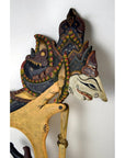 Brown wooden Wayang Kulit Indonesian shadow puppets with painted details, set of three on white background.