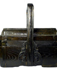 Brown elm wood wedding box with ornate carvings and tall center handle, front view, in good condition.