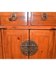 Brown wood side cabinet with two drawers, two doors, and round brass lock with ring handles on front.