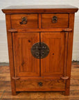 Brown wood side cabinet with metal ring handles, two top drawers, center double doors, and a bottom drawer.