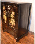 Wooden side cabinet with floral motif decoration and metal handle, displayed on a wooden floor.