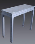 Light blue wooden side table with four straight legs, rectangular top, set against a plain gray background.