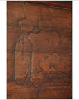 Close-up of a rustic wooden signboard with carved Chinese character, featuring textured brown wood surface.