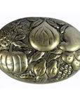 Silver plate jewelry box with oval brass accents and embossed pineapple, apple, and grapes on lid, close-up view.