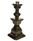 Close-up of a silver plated Indian brass candle holder with a square base and tiered geometric design.