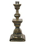 Silver plated candle holder with square base and ornate middle, Indian style, close-up.