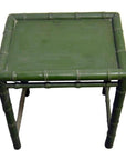 Green bamboo side table with bamboo-inspired legs and edges, shown against a plain background.