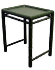 Close-up of small green bamboo side table with square top and bamboo-style legs and frame.