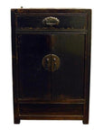 Dark wood carved side cabinet with one drawer, two doors, metal handles, and brass medallion lock plate.