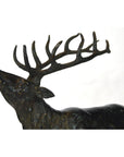 Bronze elk sculpture with large antlers, head raised, shown on a white background.