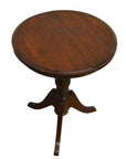 Wooden table with pedestal base and three curved legs, suitable for living room or common area use.