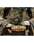 Close-up of a Taisho Samurai Doll in ornate floral-patterned fabric attire with delicate white hands.