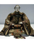 Brown fabric samurai doll in kimono and scarf, front view.