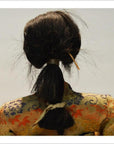 Close-up of Taisho samurai doll with dark hair tied back, patterned fabric outfit, simple background.