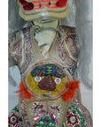 Close-up of colorful sequin and bead Taiwan Opera Doll costume with red feathers and painted chest pattern.