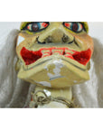 Close-up of a Taiwan Opera Doll with a worn, painted face, exaggerated features, and white hair.