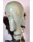 Multicolor synthetic hair Taiwan Opera doll, rear view, plain background.