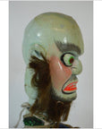Brown painted ceramic Taiwan Opera Doll side view, thick eyebrows and expressive hair and beard.