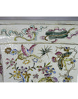 White porcelain vase with hand painted pastel flowers and butterflies, tall shape, on a plain background.