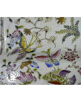 Glossy white porcelain vase with colorful hand painted butterflies and florals, tall design, studio background.