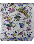 White porcelain vase with hand-painted butterflies and floral design, tall shape, shown against a plain background.