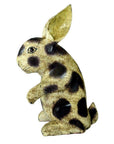 Hand painted Thai Begging Rabbit sculpture with upright ears, sitting on hind legs, left-facing on white background.