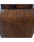 Close-up of brown wicker and wood basket with textured weave, showing side detail.