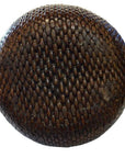 Close-up of a dark brown Thai basket with textured, scale-like surface.