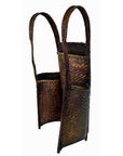 Brown woven rattan basket with two compartments and handles on a white background, 23.5 inches high.
