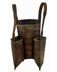 Natural rattan basket with 3 compartments, tall handles, and 4 small legs, close-up; 10" x 6" x 23.5"H.