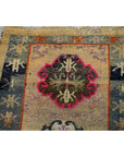 Blue, beige, and pink wool Tibetan praying rug with intricate floral medallions, 63" x 36", in good condition.