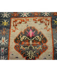 Close-up of multicolored Tibetan rug with geometric and floral patterns, vintage style, textile material, 63" x 36".