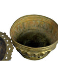 Brass tiered betel nut box with open top, decorative lid, and patched base shown side by side on plain surface.