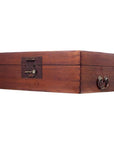 Rectangular natural wood trunk with metal keyhole and side handles, shown on a white background.