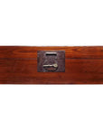 Rectangular natural wood trunk with dark metal lock against a white background.
