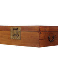 Brown wood rectangular trunk with brass hardware, metal latch, and handle on a plain white background.
