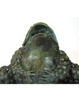 Verde gris bronze pond frog sculpture with bumpy skin and open mouth, close-up low view, in very good condition.