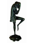 Verde gris bronze frog sculpture, "Michelle," standing on one leg with bowed head, hand on head, loose shirt.