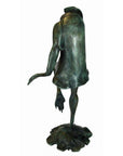 Verde gris bronze pond frog statue, headless, one-legged, wearing a coat with outstretched arm.
