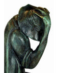 Verde gris bronze frog statue "Michelle" with head bowed, hand to forehead, lost wax method, close-up.