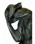 Green bronze frog statue wearing jacket and tipping hat, lost wax casting, shown on neutral background.