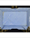 White porcelain dish with hand painted fish and seaweed design, vintage Asian style, on decorative brass stand.