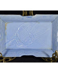 White porcelain dish with hand painted fish and seaweed design, vintage Asian style, on decorative brass stand.