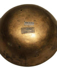 Brass vintage Indian offering bowl, round, shown upside down with two stickers, including one marked MADE IN INDIA.