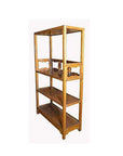 Dark wood Chinese bookcase with carved medallions, three shelves, decorative sides, on short legs, indoor setting.