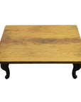Natural teak vintage Chinese coffee table with short curved legs on a plain white background.