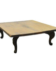 Natural teak Chinese coffee table with curved legs, vintage style, close-up of smooth wood tabletop.
